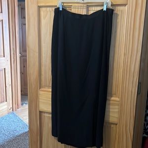 Longer business skirt with small slit in lower left.